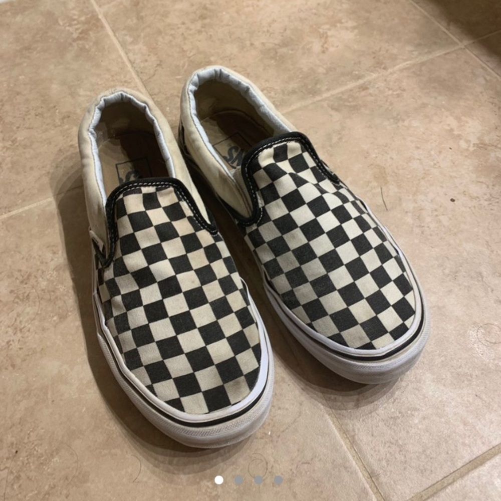 Checkered slip on vans.